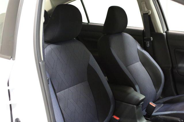 Photo of 2025 Aspen White Tricoat Nissan Versa