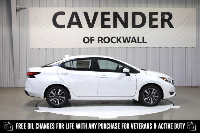 Photo of 2025 Aspen White Tricoat Nissan Versa