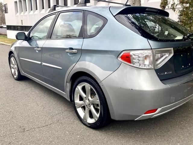 Photo of 2009 Newport Blue Pearl/Steel Silver Metallic Subaru Impreza