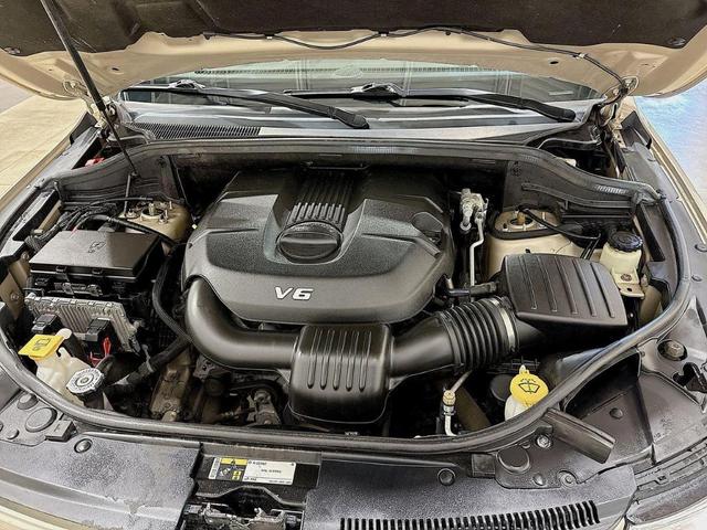 Photo of 2015 Tan Jeep Grand Cherokee
