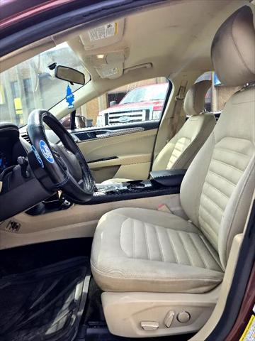 Photo of 2015 Ruby Red Tinted Clearcoat Ford Fusion