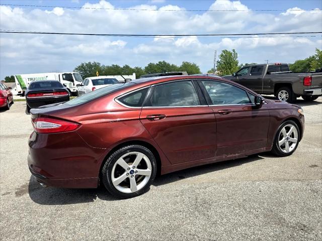 Photo of 2015 Ruby Red Tinted Clearcoat Ford Fusion