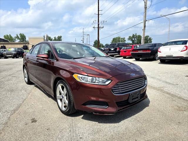 Photo of 2015 Ruby Red Tinted Clearcoat Ford Fusion