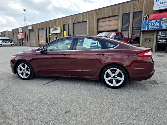 Photo of 2015 Ruby Red Tinted Clearcoat Ford Fusion