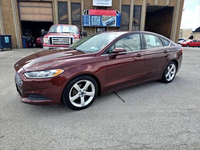 Photo of 2015 Ruby Red Tinted Clearcoat Ford Fusion