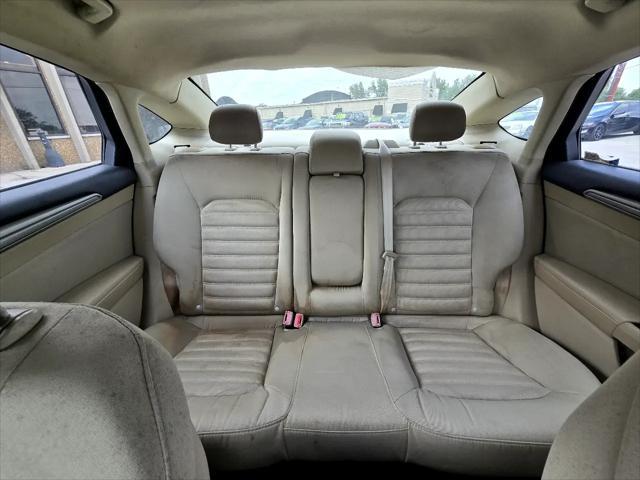 Photo of 2015 Ruby Red Tinted Clearcoat Ford Fusion