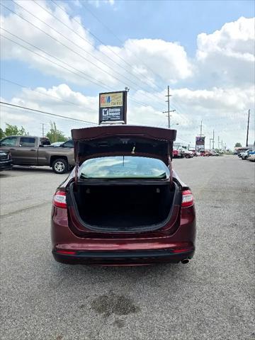Photo of 2015 Ruby Red Tinted Clearcoat Ford Fusion