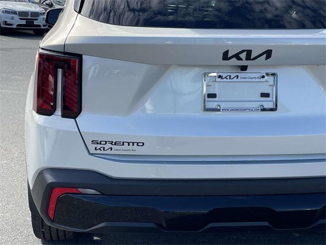Photo of 2026 Ivory Silver Kia Sorento