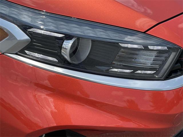 Photo of 2023 Fire Orange Kia Forte