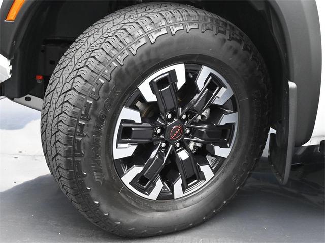 Photo of 2023 Glacier White Nissan Frontier