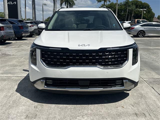 Photo of 2026 Snow White Pearl Kia Carnival Hybrid