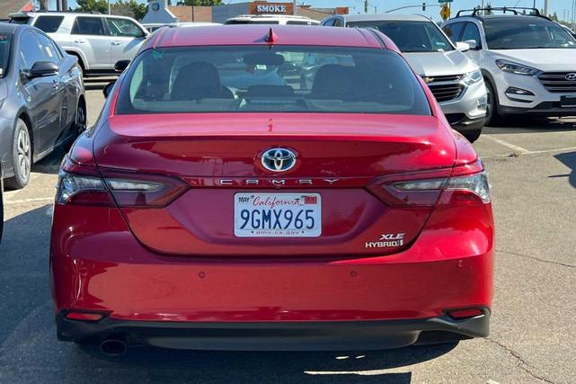 Photo of 2023 Supersonic Red Toyota Camry Hybrid