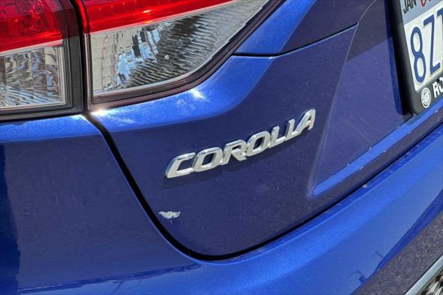 Photo of 2022 Blue Crush Metallic w/Black Sand Pearl Roof Toyota Corolla