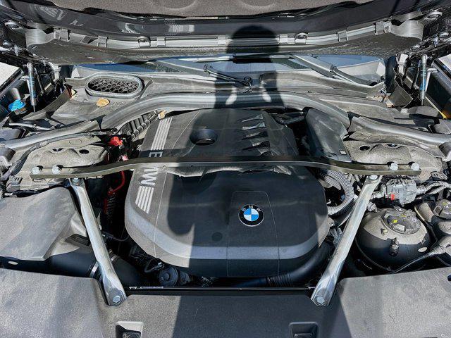 Photo of 2023 Carbon Black Metallic BMW 740