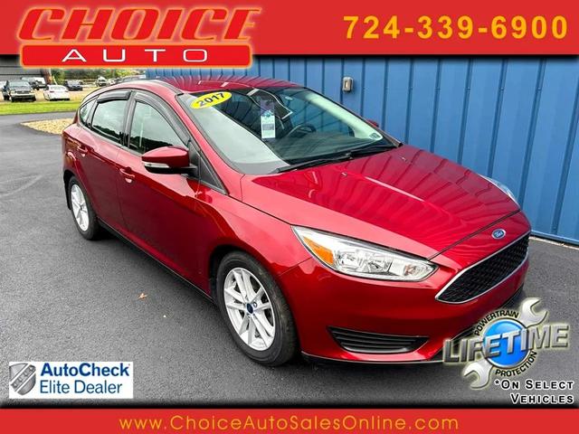 Photo of 2017 Ruby Red Metallic Tinted Clearcoat Ford Focus