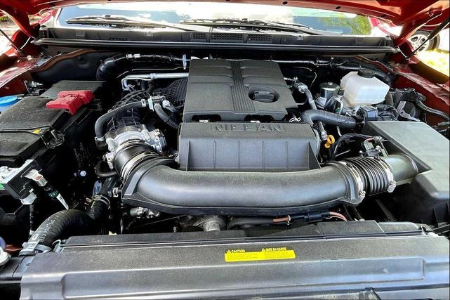 Photo of 2025 Cardinal Red Metallic Tricoat Nissan Frontier