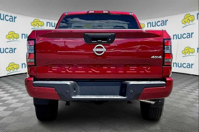 Photo of 2025 Cardinal Red Metallic Tricoat Nissan Frontier