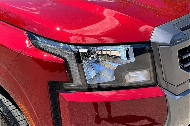 Photo of 2025 Cardinal Red Metallic Tricoat Nissan Frontier