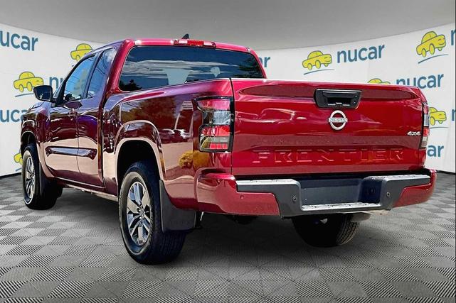 Photo of 2025 Cardinal Red Metallic Tricoat Nissan Frontier