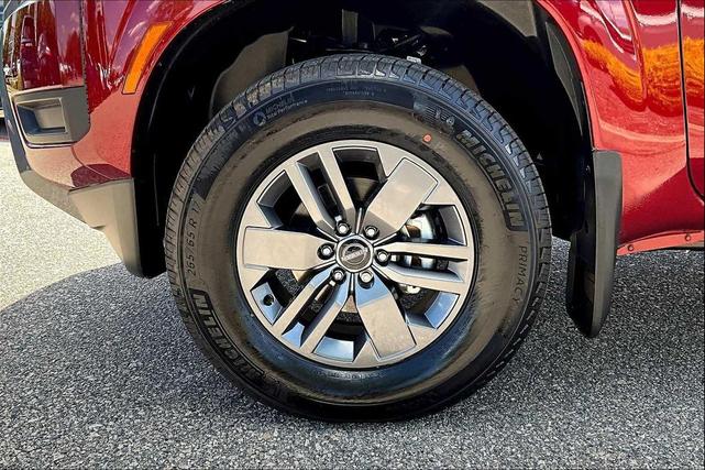 Photo of 2025 Cardinal Red Metallic Tricoat Nissan Frontier