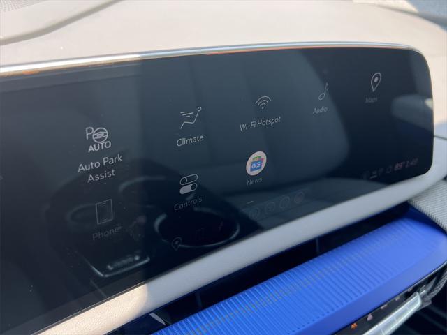 Photo of 2025 Radiant Red Tintcoat Cadillac OPTIQ