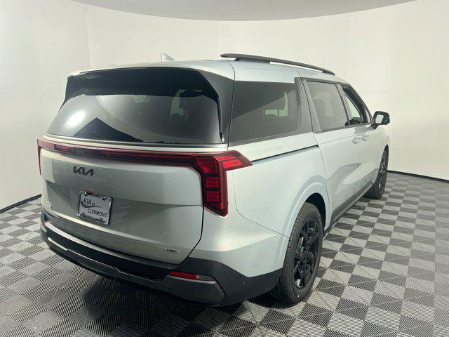 Photo of 2025 Ivory Silver Kia Carnival Hybrid