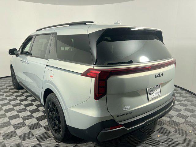 Photo of 2025 Ivory Silver Kia Carnival Hybrid