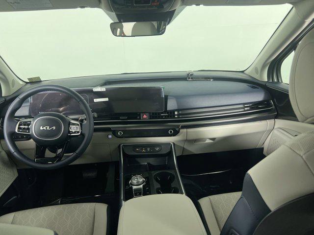 Photo of 2025 Ivory Silver Kia Carnival Hybrid