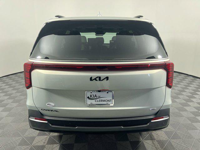 Photo of 2025 Ivory Silver Kia Carnival Hybrid