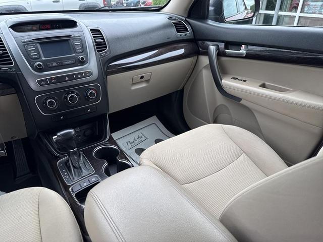 Photo of 2014 Remington Red Metallic Kia Sorento