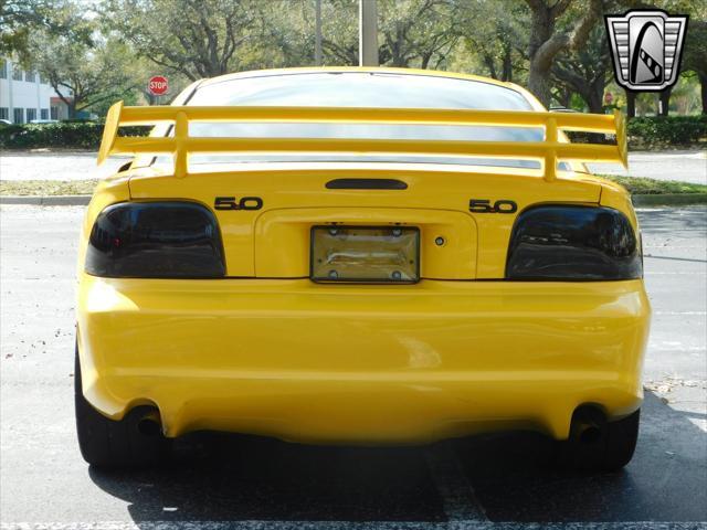 Photo of 1995 Yellow Ford Mustang