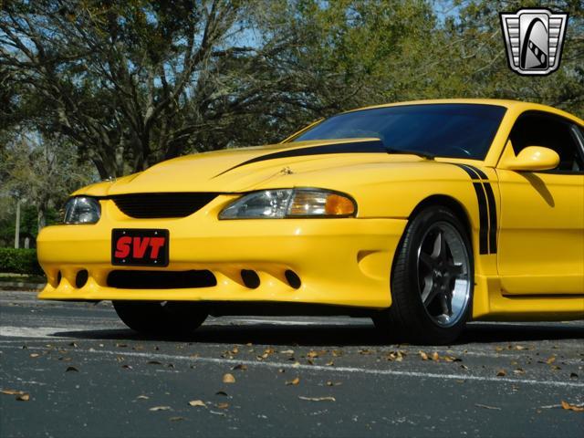 Photo of 1995 Yellow Ford Mustang