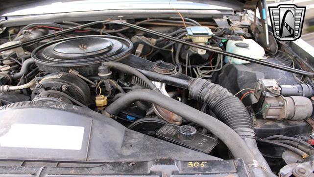 Photo of 1985 Black Cadillac Seville