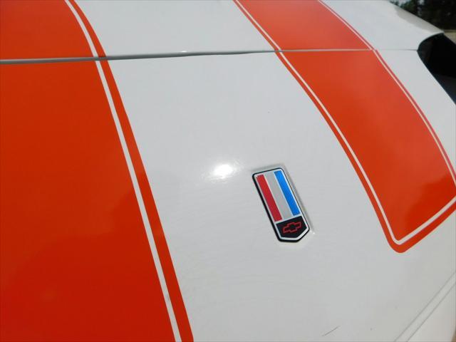 Photo of 1997 White with orange racing stripes Chevrolet Camaro