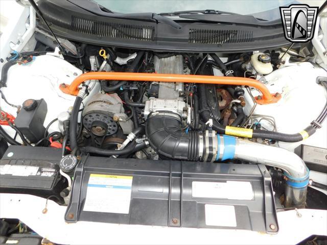 Photo of 1997 White with orange racing stripes Chevrolet Camaro