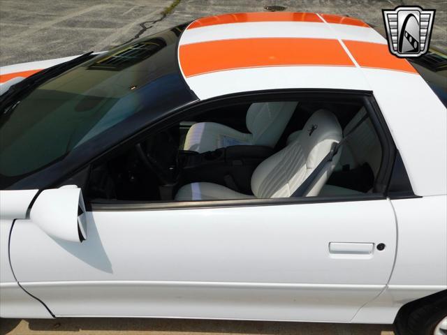 Photo of 1997 White with orange racing stripes Chevrolet Camaro