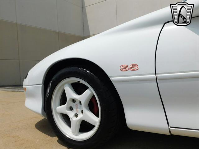 Photo of 1997 White with orange racing stripes Chevrolet Camaro