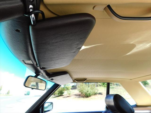 Photo of 1987 Tan Mercedes-Benz 560SL