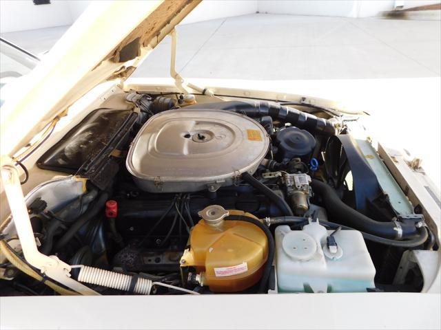 Photo of 1987 Tan Mercedes-Benz 560SL