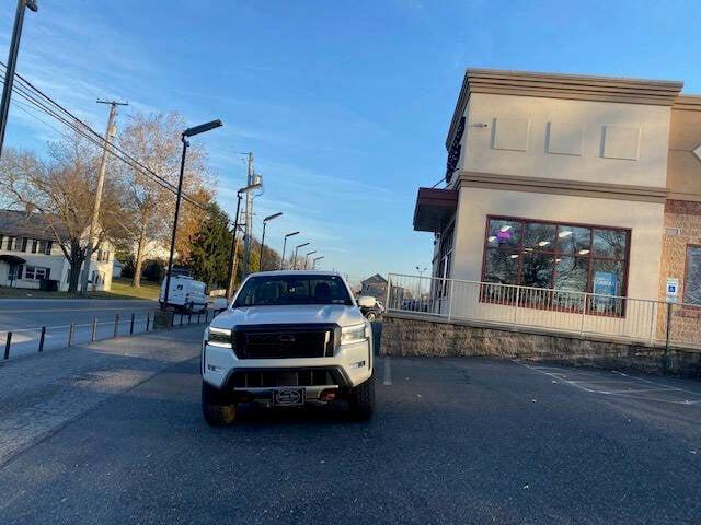 Photo of 2023 Glacier White Nissan Frontier