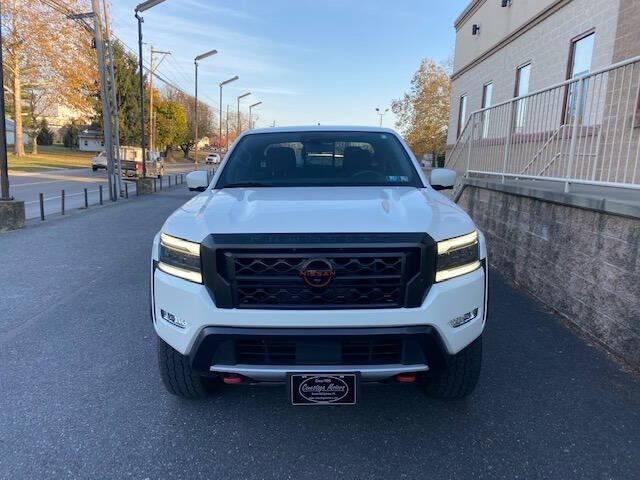 Photo of 2023 Glacier White Nissan Frontier