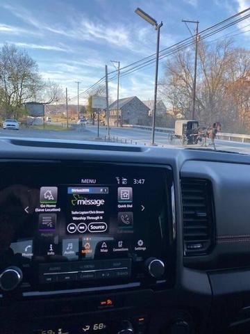 Photo of 2023 Glacier White Nissan Frontier
