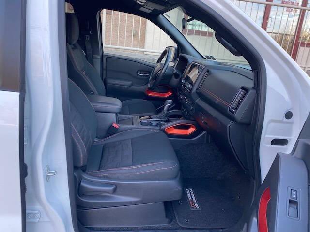 Photo of 2023 Glacier White Nissan Frontier