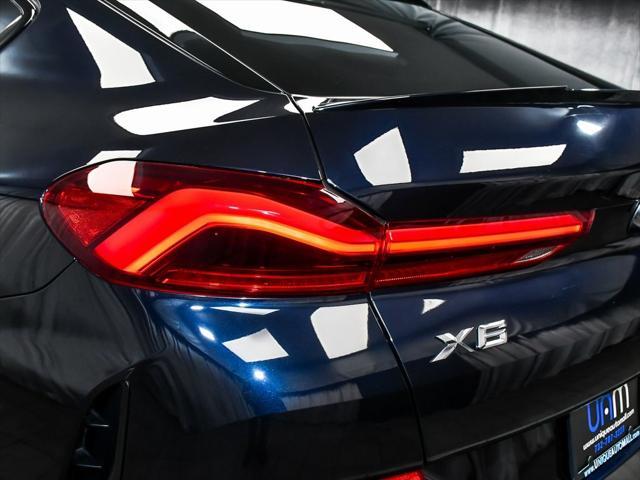 Photo of 2025 Carbon Black Metallic BMW X6