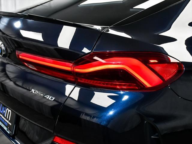 Photo of 2025 Carbon Black Metallic BMW X6