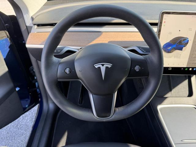 Photo of 2024 Deep Blue Metallic Tesla Model Y