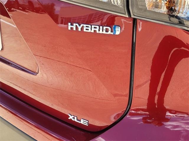 Photo of 2023 Ruby Flare Pearl Toyota Highlander Hybrid