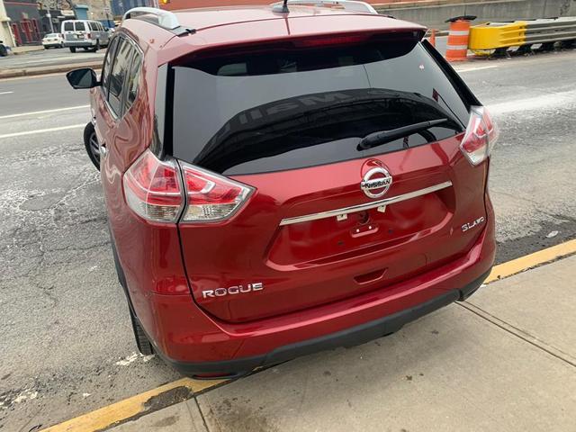 Photo of 2015 Cayenne Red Nissan Rogue