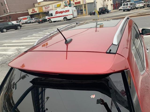 Photo of 2015 Cayenne Red Nissan Rogue