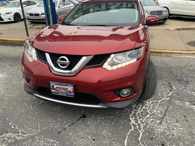 Photo of 2015 Cayenne Red Nissan Rogue